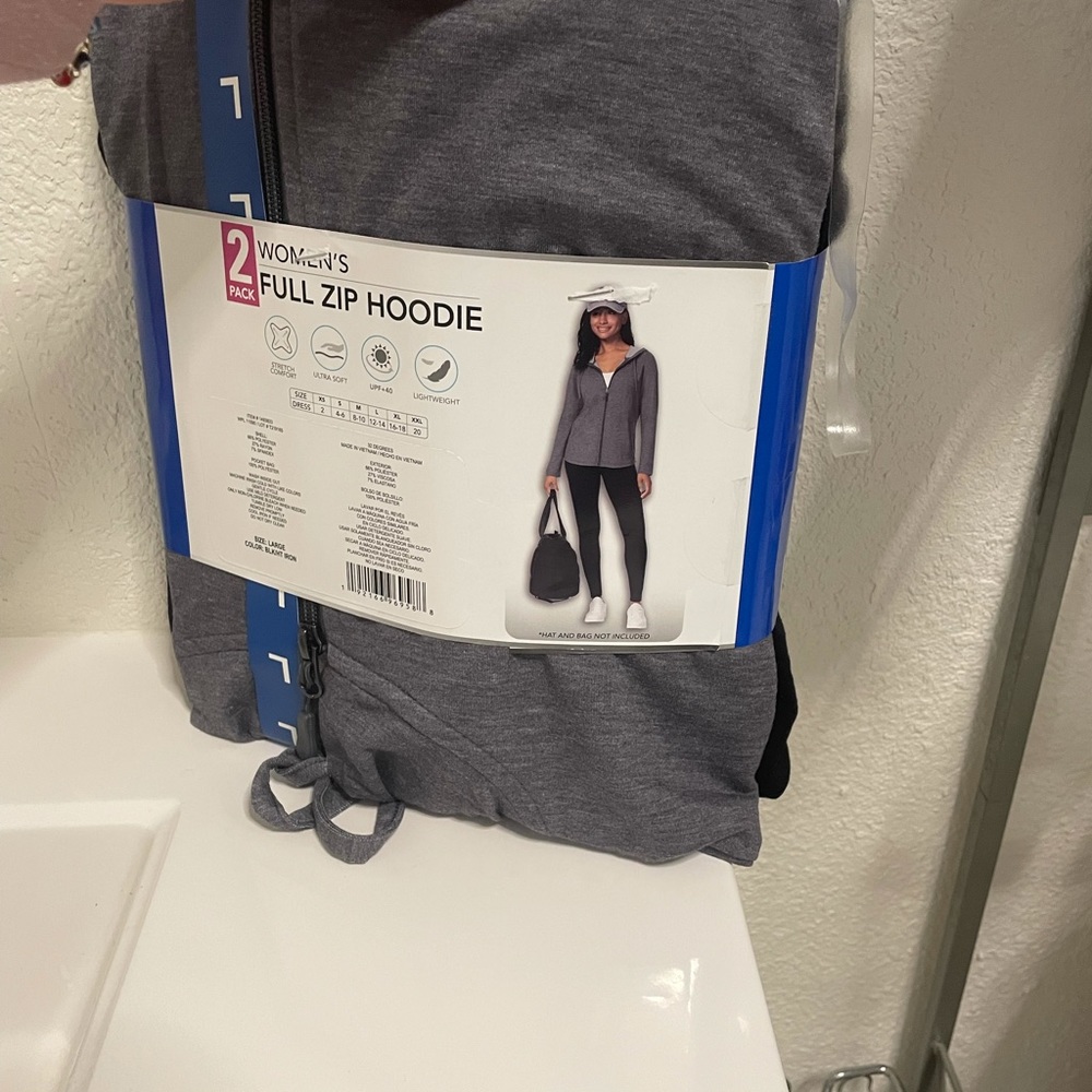 Two pack women’s zip up hoodies . Black & grey .